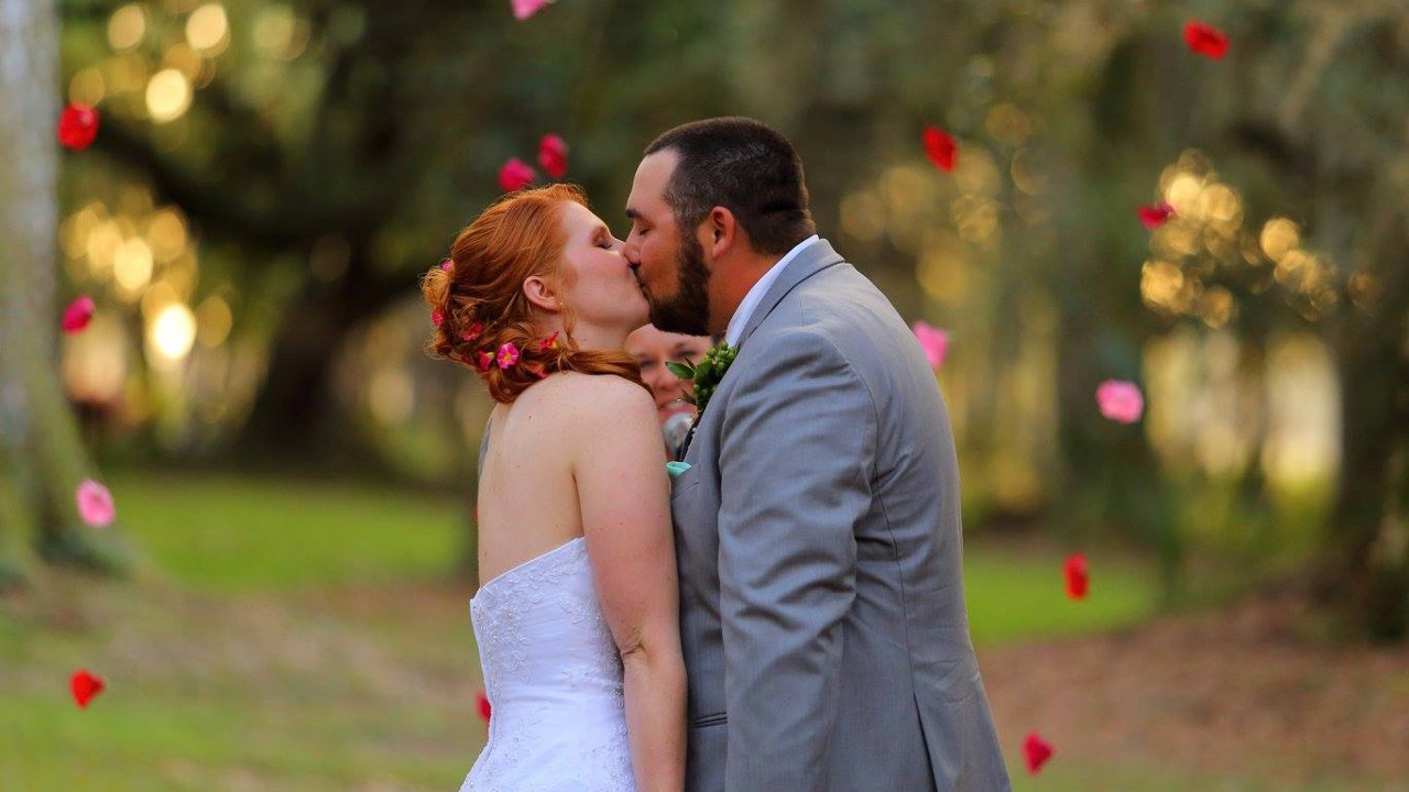 Close-up of husband and wife having their First Kiss.